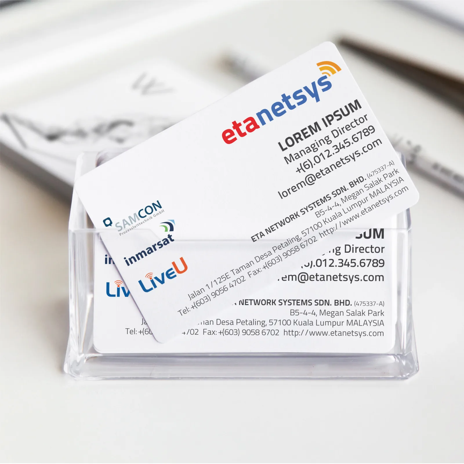 ETA Network Systems business cards in a clear holder