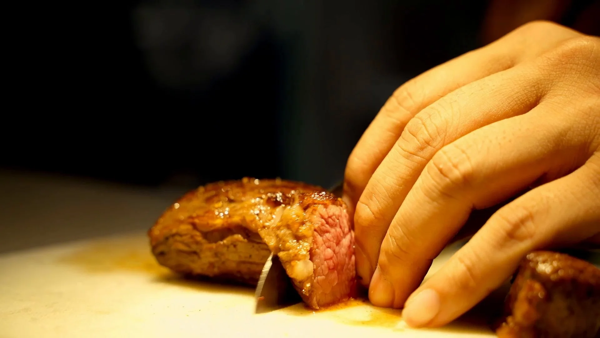 Hand slicing the seared Wagyu